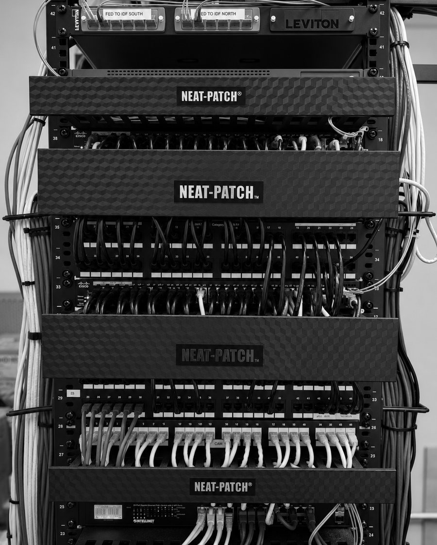 A completed IDF with patch panels, switches and cable management